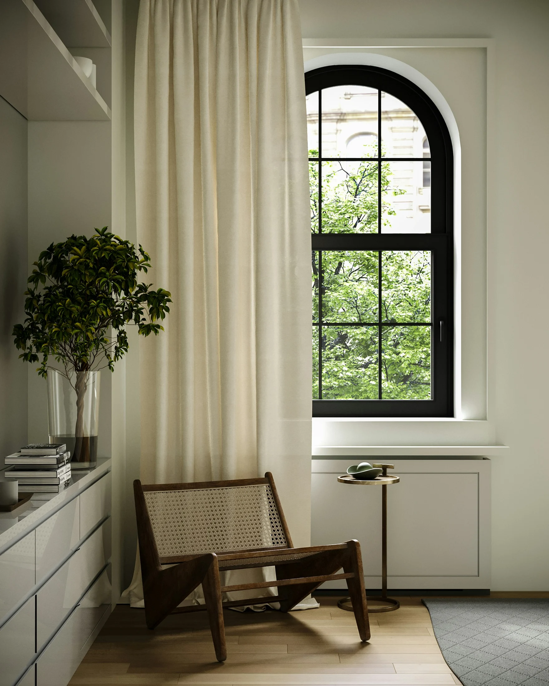 A quiet corner with an arched window, linen curtain and a cane lounge chair