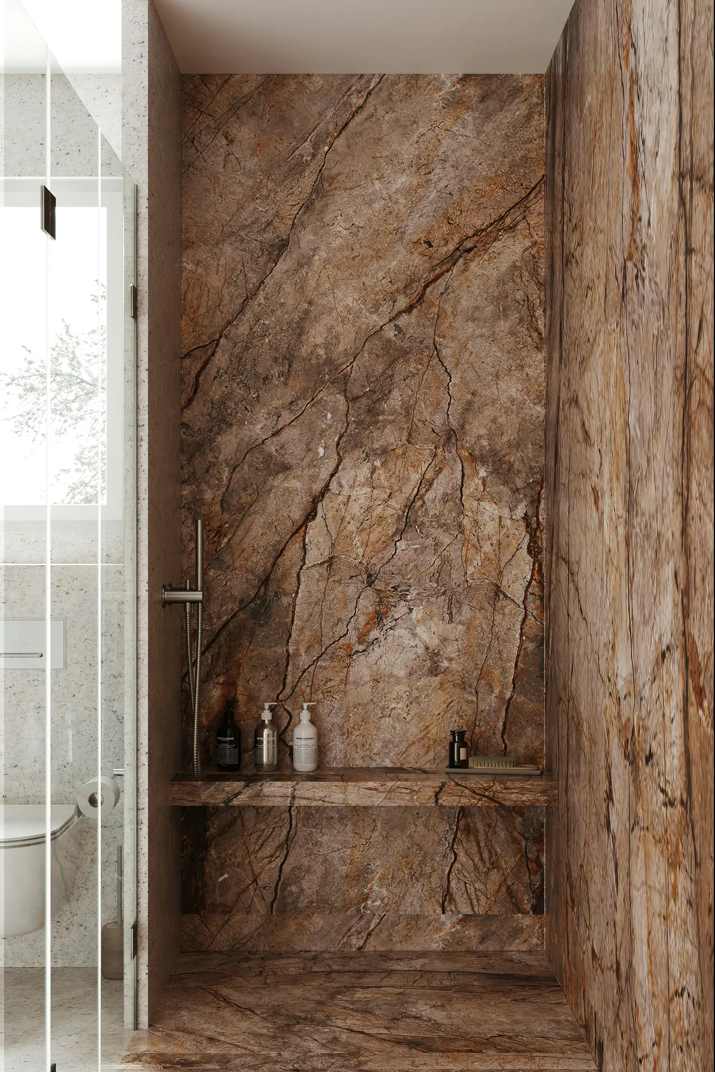 A shower lined in veined brown marble